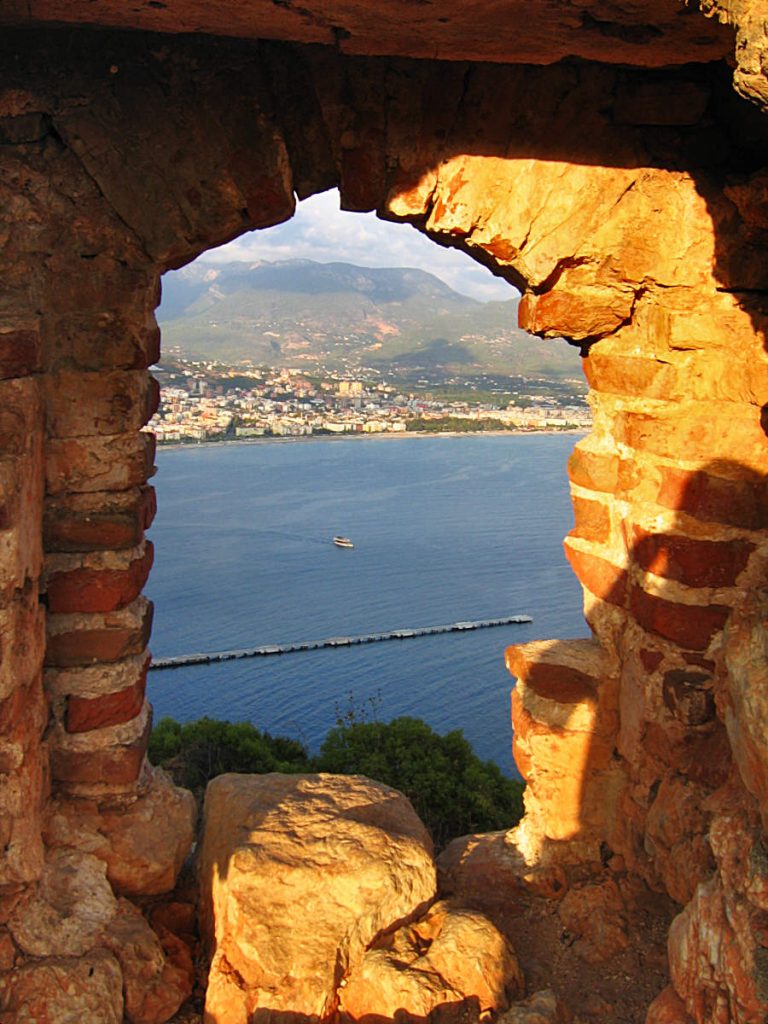 View over Alanya from the Castle through the window in the wall.