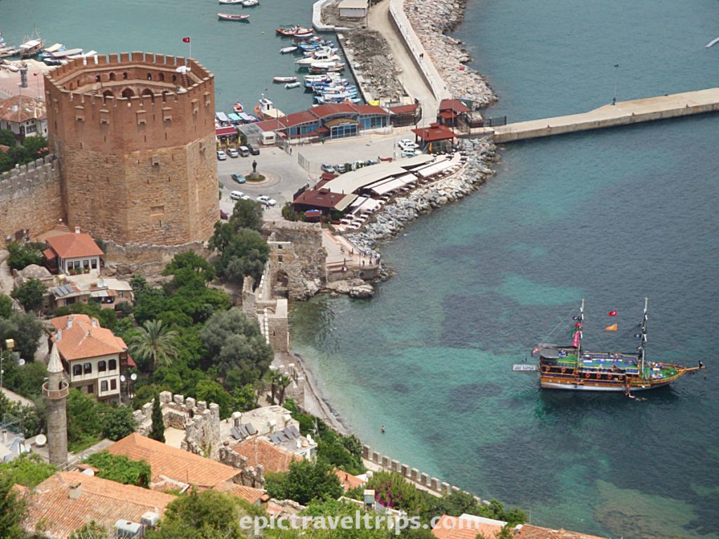 View from the hill over Alanya Red Tower (Kizilkule) with the gulet boat in the port.