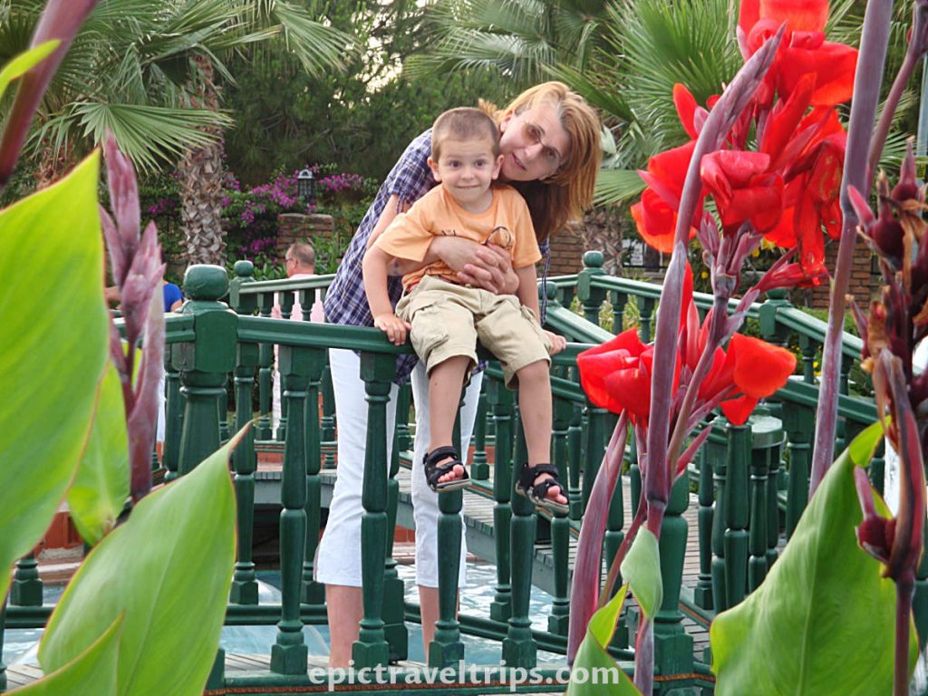 Boy and mom in the park garden