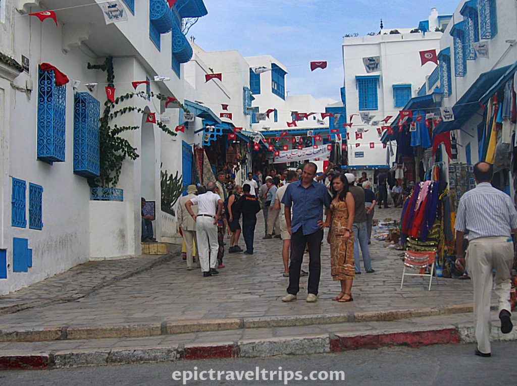Sidi Bou Said white walls, blue windows, shopping street with lots of pedestrians in Tunis City