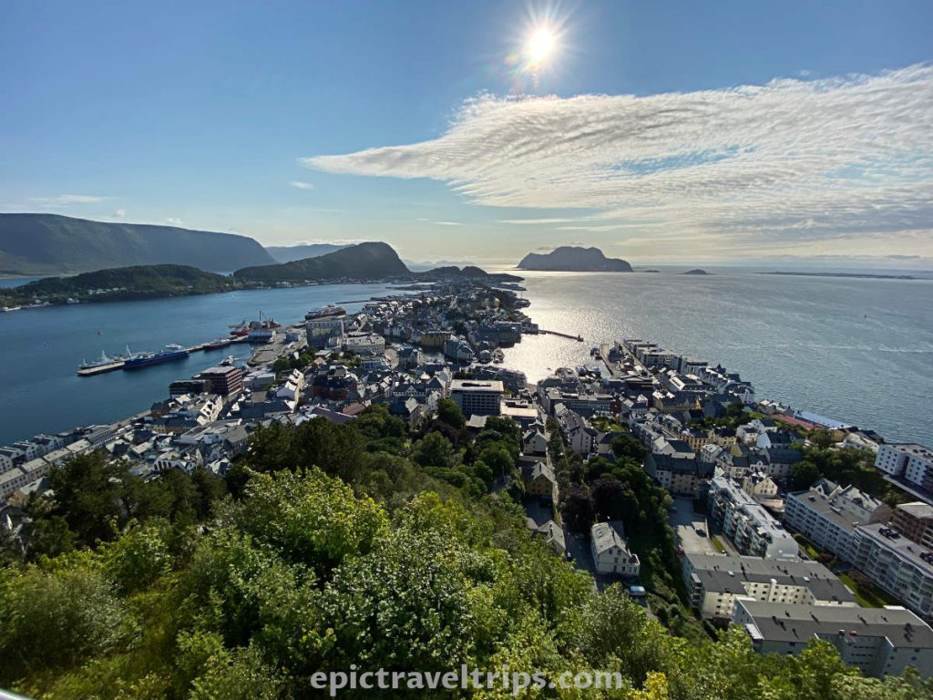 View over Ålesund with the sun on the horizon from Aksla viewpoint.