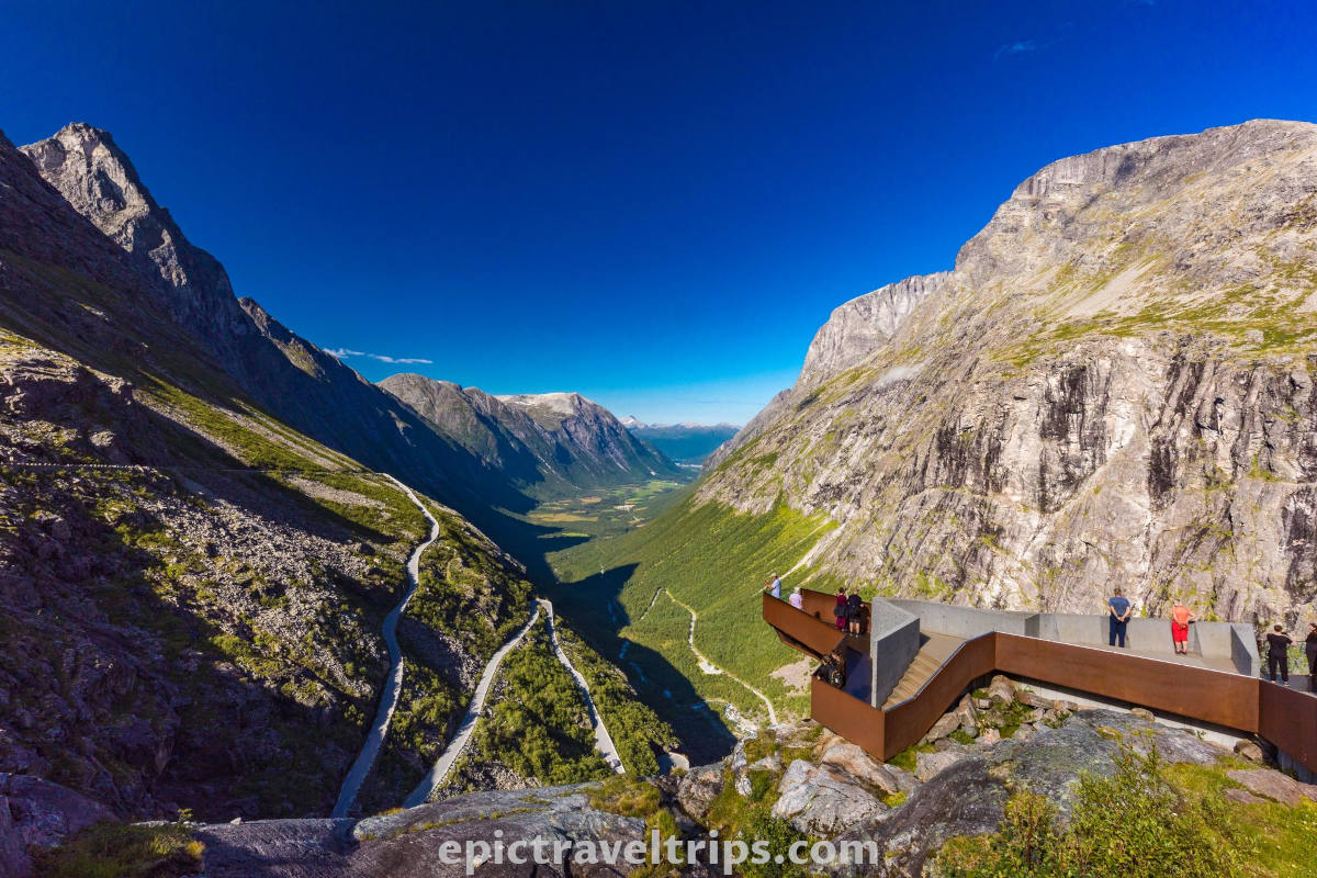 Viewpoint over Trollstigen mountain road and the valley on a sunny day in Norway.