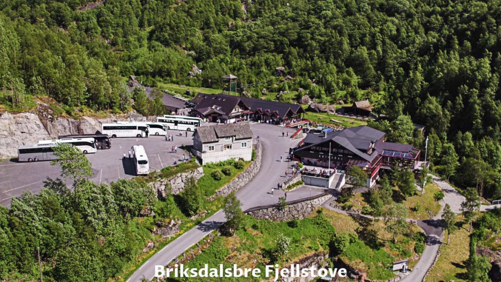 Briksdal mountain lodge restaurant and bus parking space aerial view in Norway.