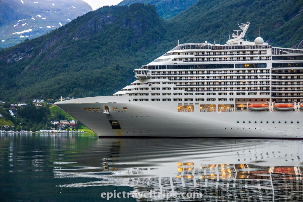 Big white cruiseliner at Geiranger port in Norway.