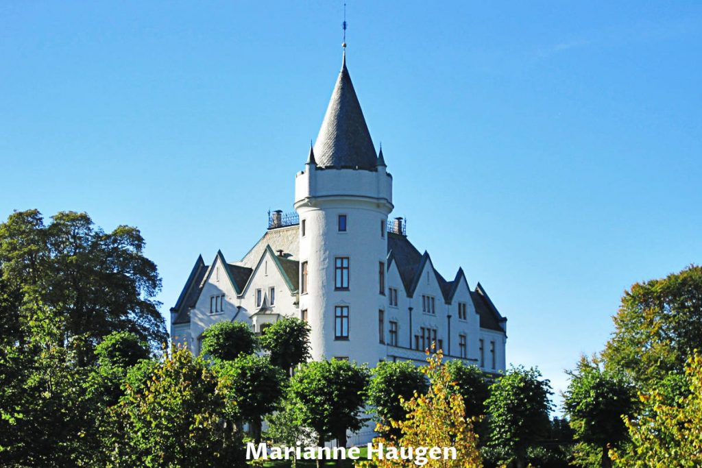 Gamlehaugen is a King's residence with white walls and tall tower