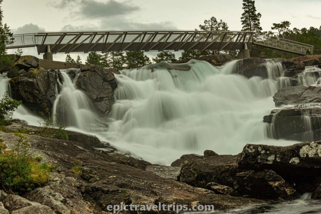 Likholefossen silky waterfall with a bridge in Norway.