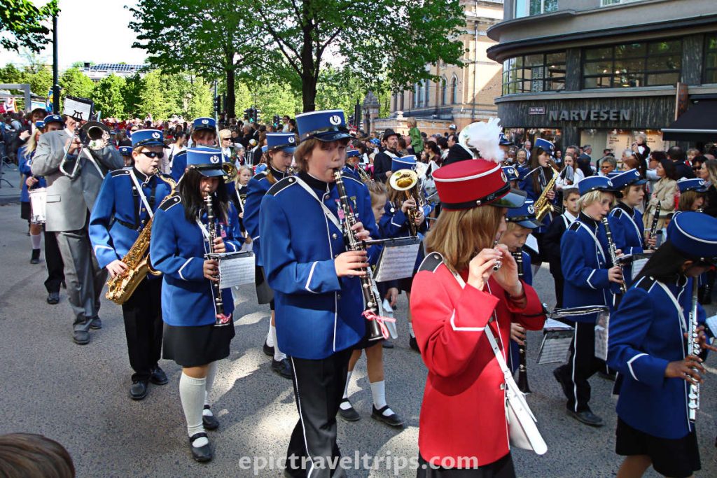 Kids marching band in blue uniforms on Constitution Day 17th of May celebration at Oslo in Norway.