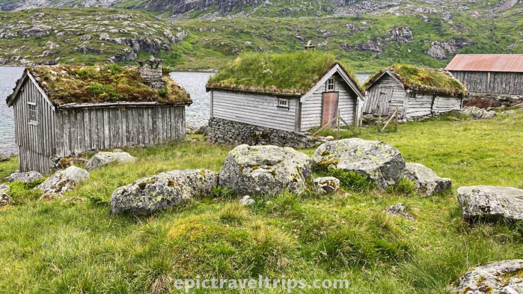 Wooden houses with grass roofs near lake Nystølvatnet in Norway.