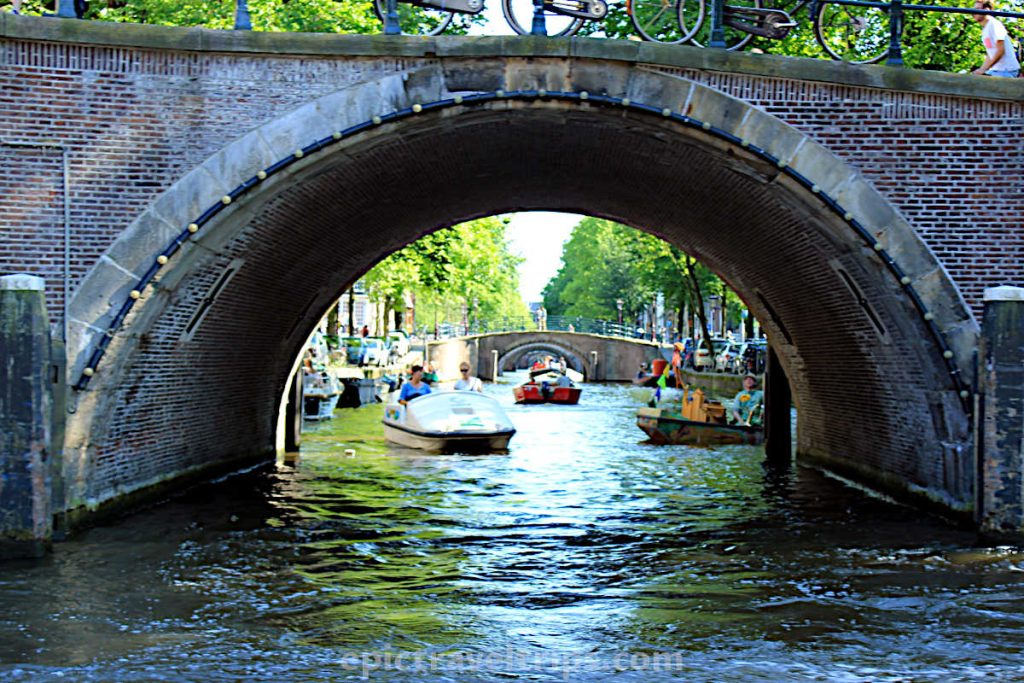 Under the bridge where you can see fifteen bridges in Amsterdam in The Netherlands
