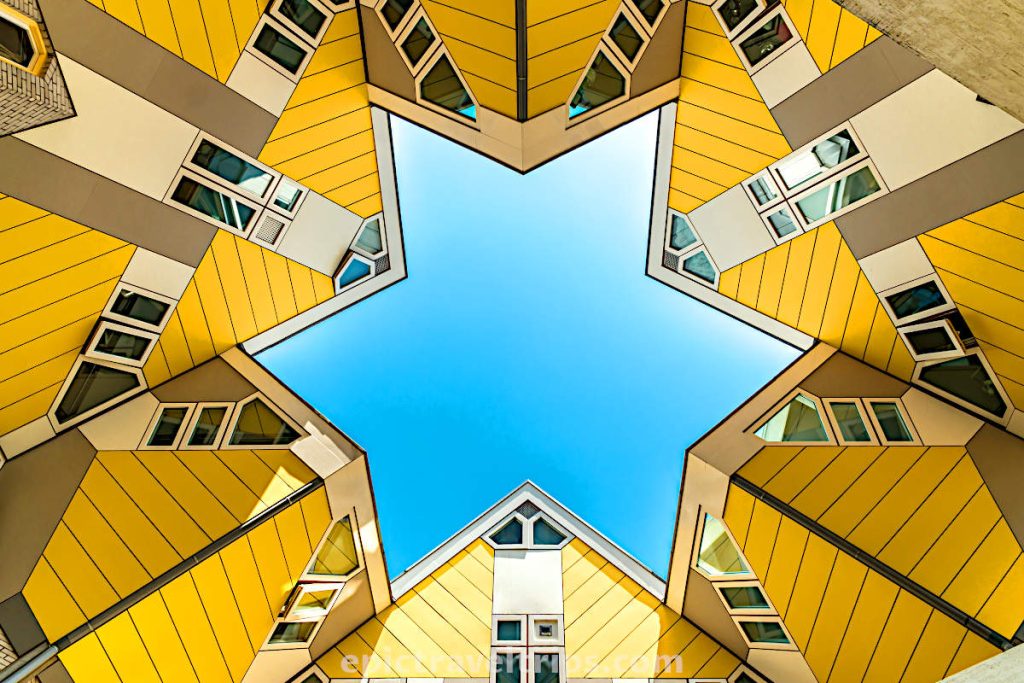 Yellow Cube houses and blue sky in a star shape in Rotterdam in The Netherlands.