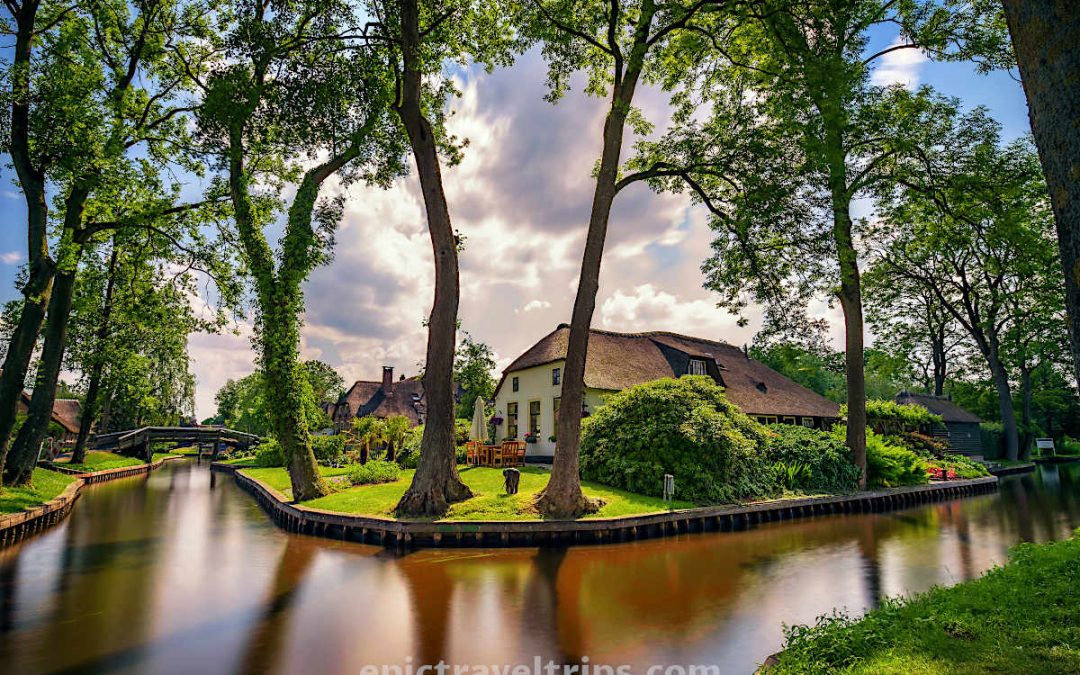 Long exposure photo of the canal and a beautiful house at Giethoorn Village in The Netherlands
