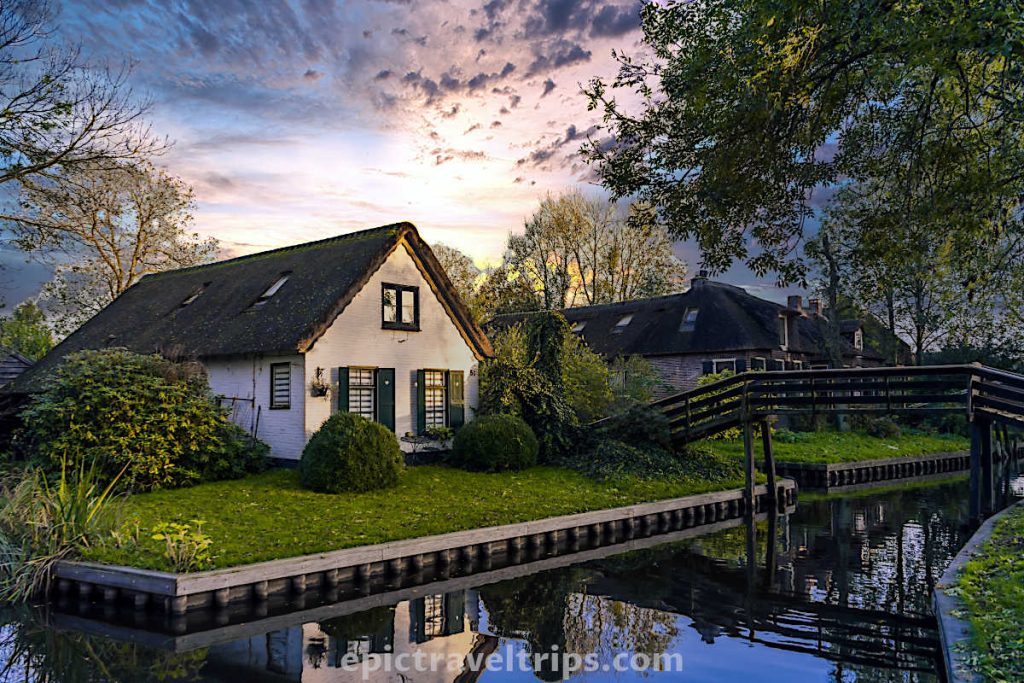 The beautiful white house at sunset at Giethoorn Village in The Netherlands