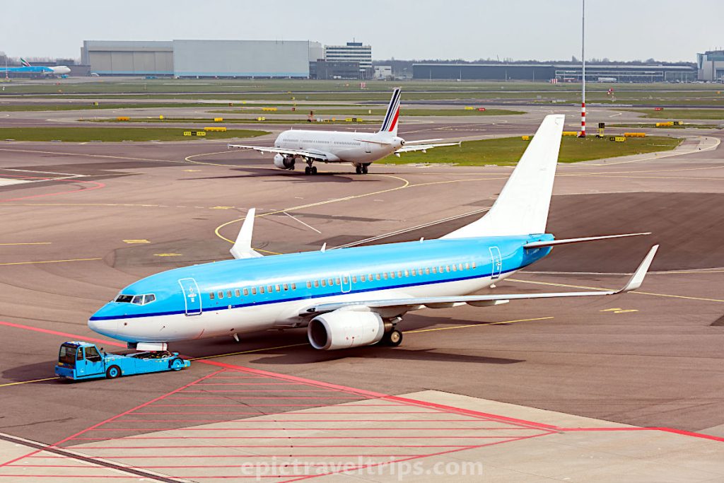 Blue KLM airplane on the runway in The Netherlands.