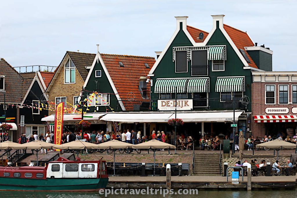 Panorama view of the houses and restaurants at Volendam harbor in The Netherlands